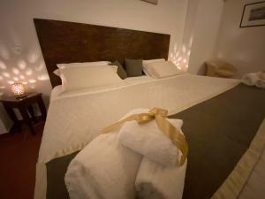 Un ou plusieurs lits dans un hébergement de l'établissement Miro B&B