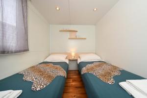 Postel nebo postele na pokoji v ubytování Apartmani Miluška + 37 fotografií