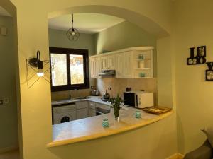 A kitchen or kitchenette at El gouna South Marina Townhouse Apartment 3 bedrooms