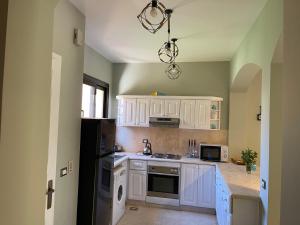 A kitchen or kitchenette at El gouna South Marina Townhouse Apartment 3 bedrooms