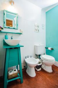 a bathroom with a sink and a toilet at Lo De Sara in Yerba Buena