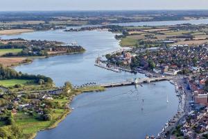 an aerial view of a river with a bridge at Ferienwohnung Fleckeby Schlei Fjord Light in Fleckeby
