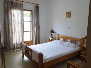 Ένα ή περισσότερα κρεβάτια σε δωμάτιο στο Paradise Inn
