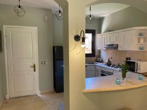 A kitchen or kitchenette at El gouna South Marina Townhouse Apartment 3 bedrooms