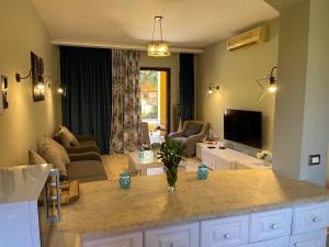 A television and/or entertainment centre at El gouna South Marina Townhouse Apartment 3 bedrooms