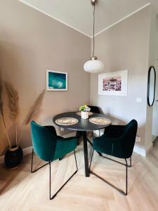 a dining room with a table and chairs at Boutique Apartment - Old Town in Wrocław