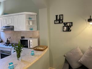 A kitchen or kitchenette at El gouna South Marina Townhouse Apartment 3 bedrooms