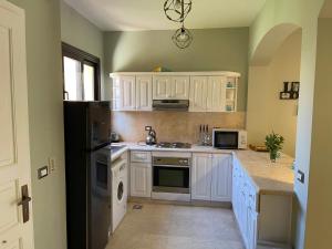 A kitchen or kitchenette at El gouna South Marina Townhouse Apartment 3 bedrooms