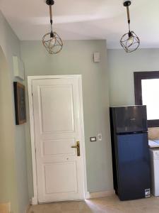 A kitchen or kitchenette at El gouna South Marina Townhouse Apartment 3 bedrooms