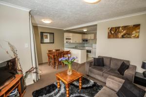 a living room with a couch and a table at Winter Getaway in Methven