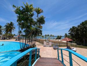 a resort pool with a view of the ocean at Le Laïlana in Sainte-Anne +8 photos