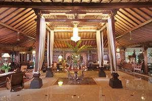 a lobby of a resort with a table and chairs at Jogloplawang Villa&Resort in Kaliurang