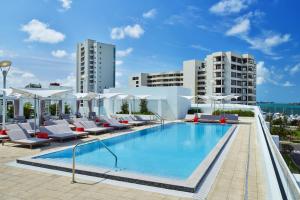 a pool on the roof of a building at Art Ovation Hotel, Autograph Collection in Sarasota
