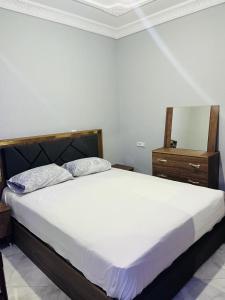 En eller flere senge i et værelse på Apartment Asilah