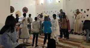 a group of people standing in a room at Torya Nubian House in Aswan