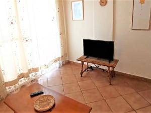 A television and/or entertainment centre at House in paradisiacal beach area La Isleta, Níjar