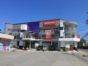 a parking lot in front of a building at Sumo Asia Hotels - Davao in Davao City