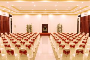 an empty hall with rows of chairs and a podium at Zamzam Hotel and Convention Batu Powered By Archipelago in Batu +49 photos