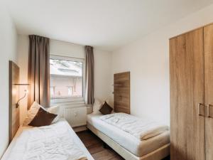Postel nebo postele na pokoji v ubytování Rosenheim