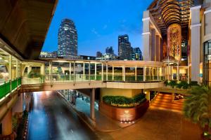 a view of a building with a city in the background at Sheraton Grande Sukhumvit, a Luxury Collection Hotel, Bangkok in Bangkok