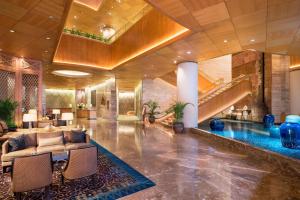 a lobby of a hotel with a swimming pool at Sheraton Grande Sukhumvit, a Luxury Collection Hotel, Bangkok in Bangkok