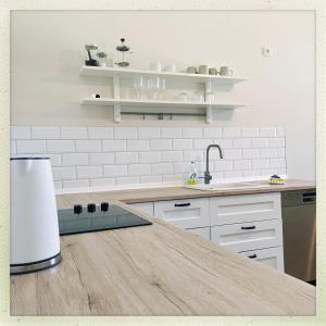 a kitchen with a counter top and a sink at Wohnen im Baudenkmal mitten in der Altstadt in Arnsberg