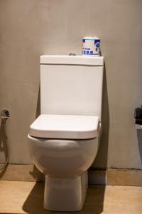 a toilet with a roll of toilet paper on top of it at Wild Trails Yala by Suri in Yala