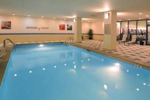 a swimming pool in a hotel lobby with a hotel at Denver Marriott South at Park Meadows in Lone Tree