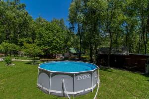 a swimming pool in the grass in a yard at Holiday house with a swimming pool Breze, Novi Vinodolski - 20493 in Novi Vinodolski