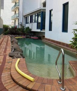 a swimming pool with a banana in the middle of a building at Sea View Full Apartment at Darwin City Heart in Darwin