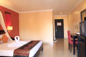 Postel nebo postele na pokoji v ubytování Mekong Angkor Palace Inn