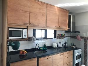 A cozinha ou cozinha compacta de Tu hogar en Piriápolis