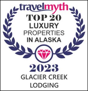 un logotipo para los mejores alojamientos de lujo de albia en Glacier Creek Lodging, en Seward