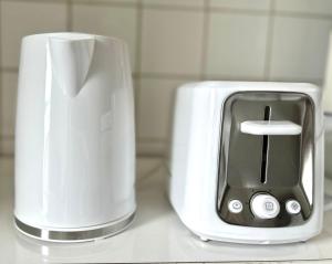 a toaster and a napkin dispenser on a counter at Albert Housing in Windsor