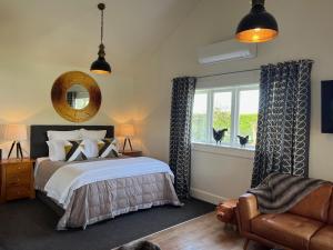 a bedroom with a bed and a window at The Studio at Northfield in Methven