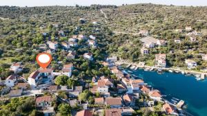 an aerial view of a small town next to the water at Apartments Villa LA in Drvenik Veli