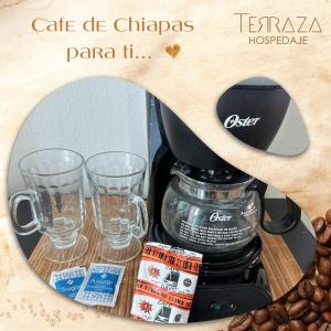 a coffee maker with two glasses and coffee beans at Terraza Sancris in Tuxtla Gutiérrez