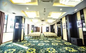 a conference room with tables and chairs in a building at Putin Hotel Nha Trang in Nha Trang