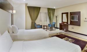 Cama o camas de una habitación en Mina Concorde Hotel