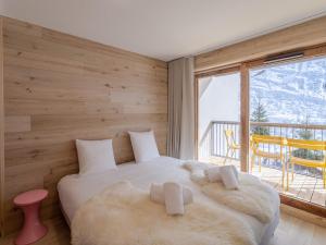 Posteľ alebo postele v izbe v ubytovaní Bel appartement tout équipé proche des pistes - FR-1-563-131