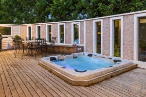 a hot tub on the deck of a house at Sun Valley - Boutique Portsea Accommodation in Portsea