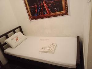 Postel nebo postele na pokoji v ubytování WJV INN Mandaue Centro
