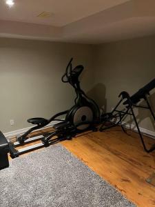 a room with a exercise bike on the floor at Sweet home in Ottawa