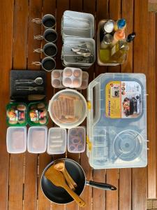 a bunch of food items and a pan and utensils at iGo Glamz 爱狗露营 Pet Friendly Glamping in Genting Highlands