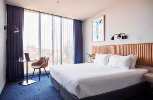 Postel nebo postele na pokoji v ubytování Mantra Melbourne Epping + 37 fotografií