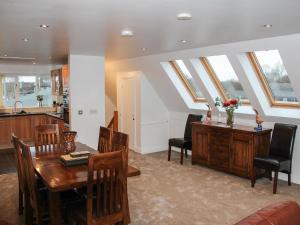 a kitchen and dining room with skylights at Wherrymere in Horning