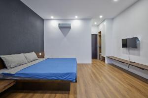 TV a/nebo společenská místnost v ubytování The Garden Capsule Hotel + 35 fotografií