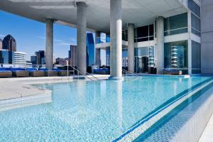 a swimming pool on the roof of a building at W Dallas - Victory in Dallas