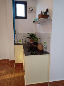 a kitchen with a sink and a counter top at KOL House in Phnom Penh