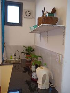 a bathroom with a toilet and a sink at KOL House in Phnom Penh